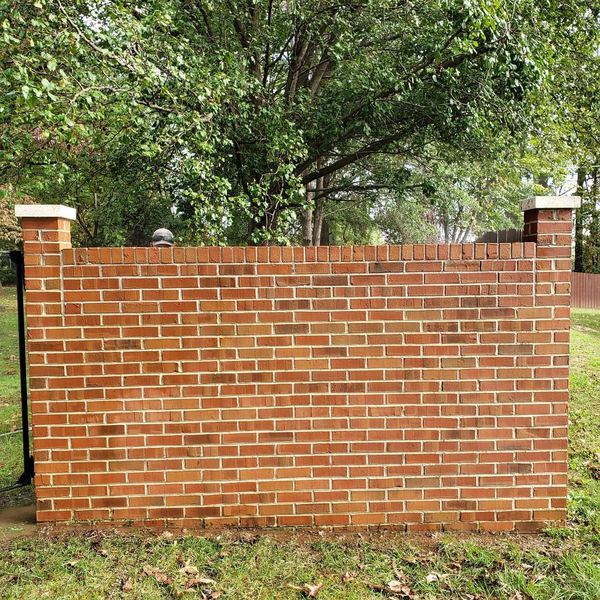 Brick privacy wall restored